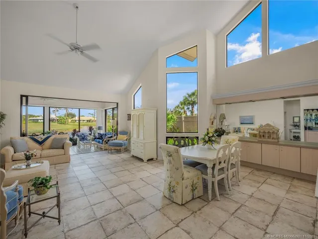 a view of a dining room with furniture window and outside view
