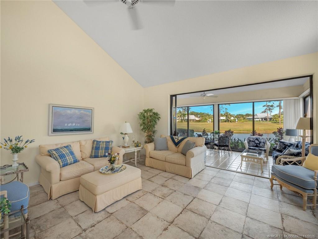 5011 Southeast Brandywine Way Stuart, FL 34997 - Photo 6 of 19 a living room with furniture and a large window