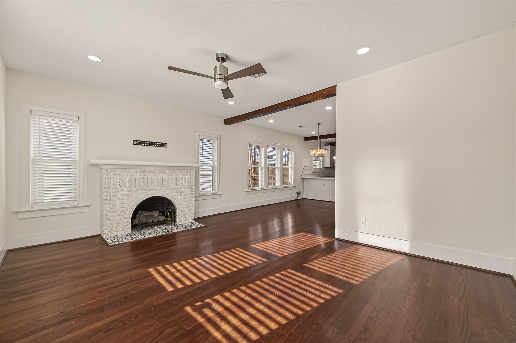 2417 Ruth Street Houston, TX 77004 - Photo 19 of 33 a view of an empty room with wooden floor fireplace and a window