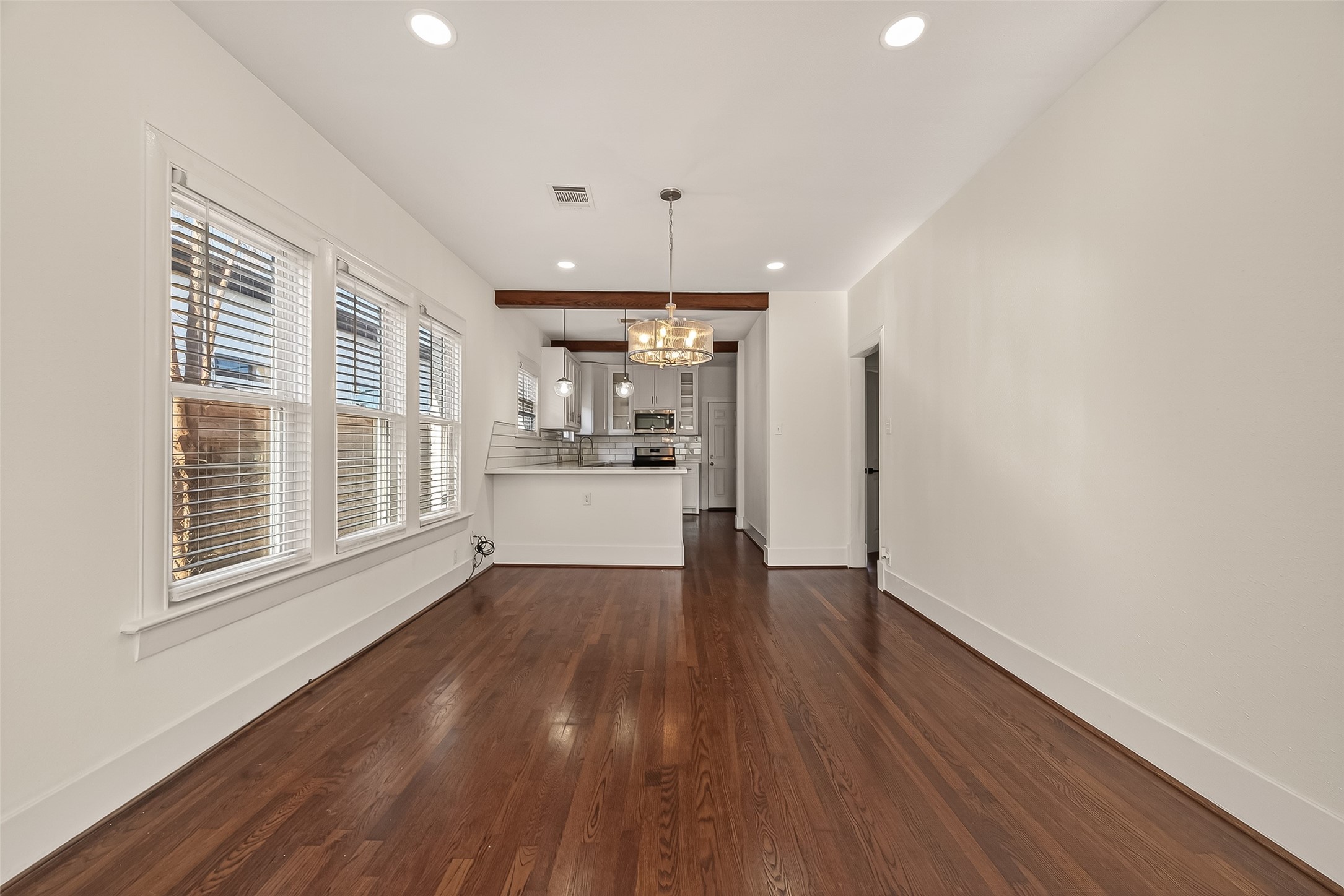 2417 Ruth Street Houston, TX 77004 - Photo 21 of 33 a view of a kitchen with wooden floor and a window
