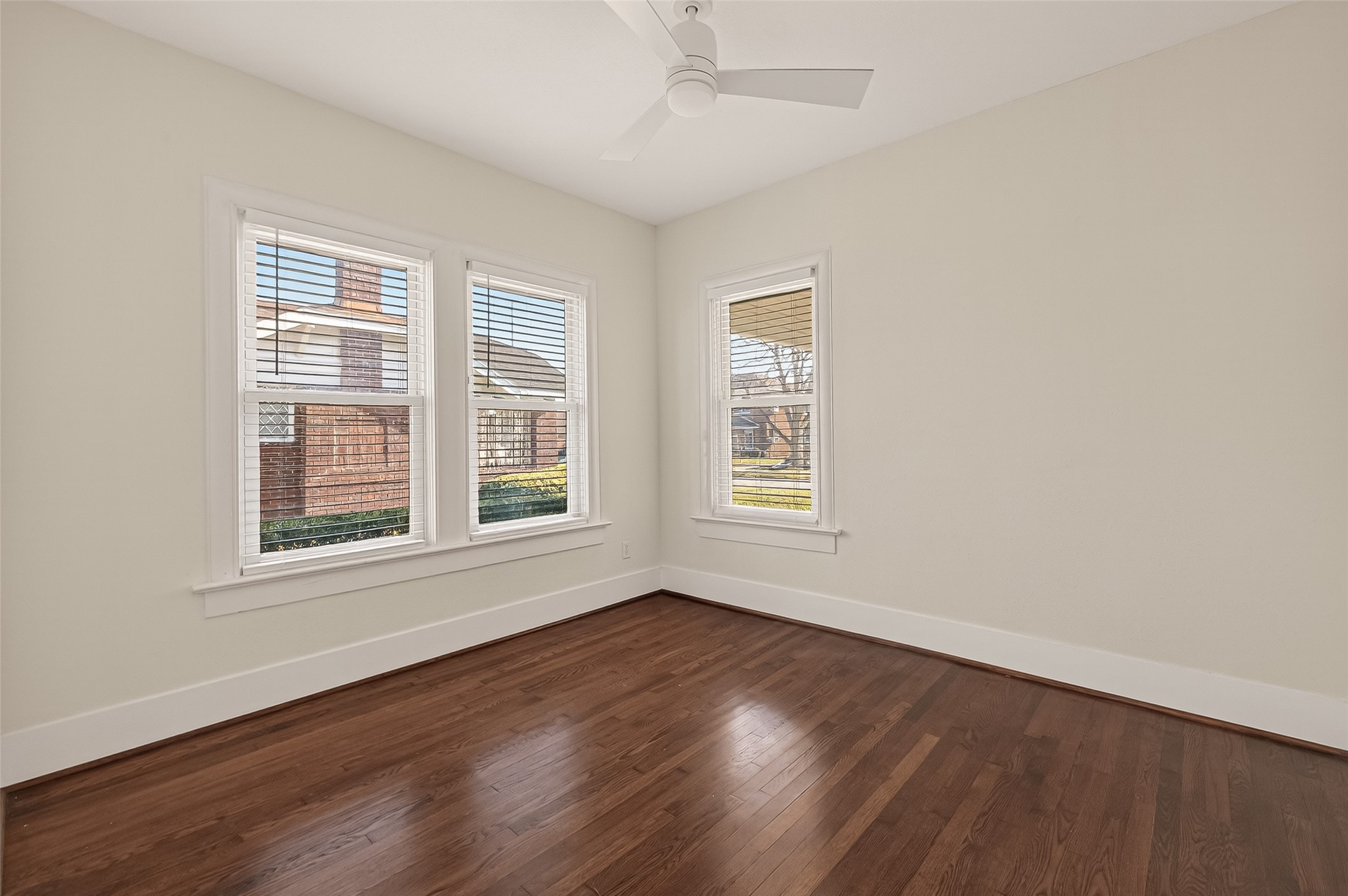 2417 Ruth Street Houston, TX 77004 - Photo 24 of 33 an empty room with wooden floor and windows