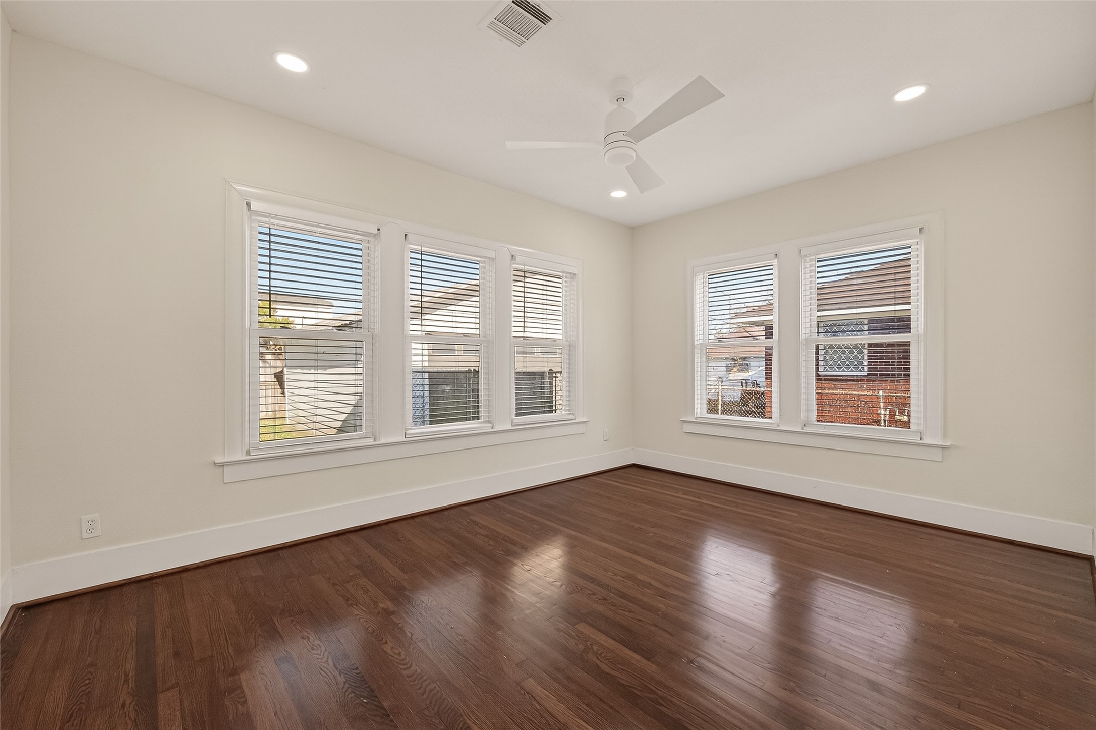 2417 Ruth Street Houston, TX 77004 - Photo 27 of 33 a view of an empty room with wooden floor and a window