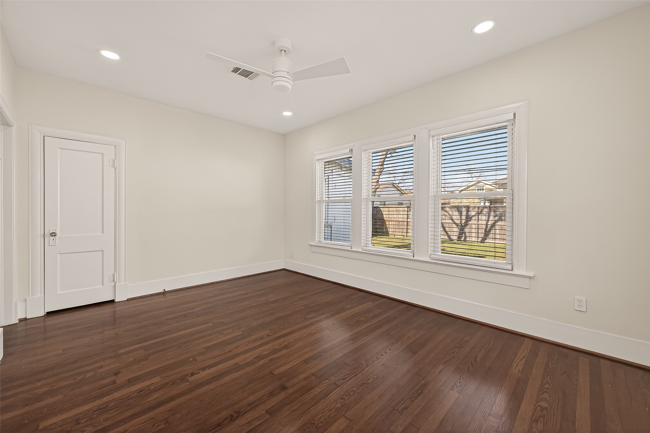 2417 Ruth Street Houston, TX 77004 - Photo 30 of 33 an empty room with wooden floor and windows
