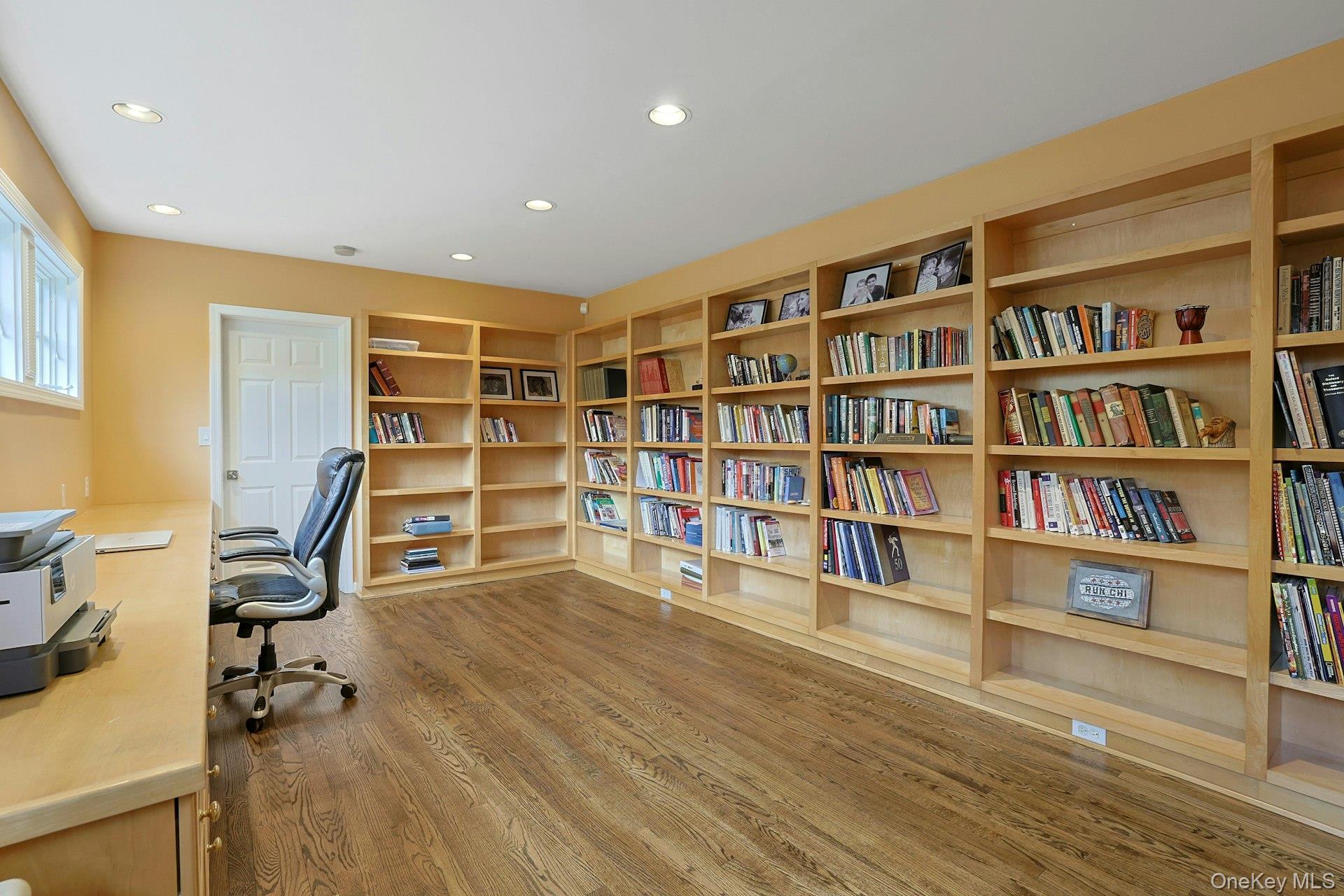 8 Creemer Road Armonk, NY 10504 - Photo 12 of 38 a view of a livingroom with furniture and shelves