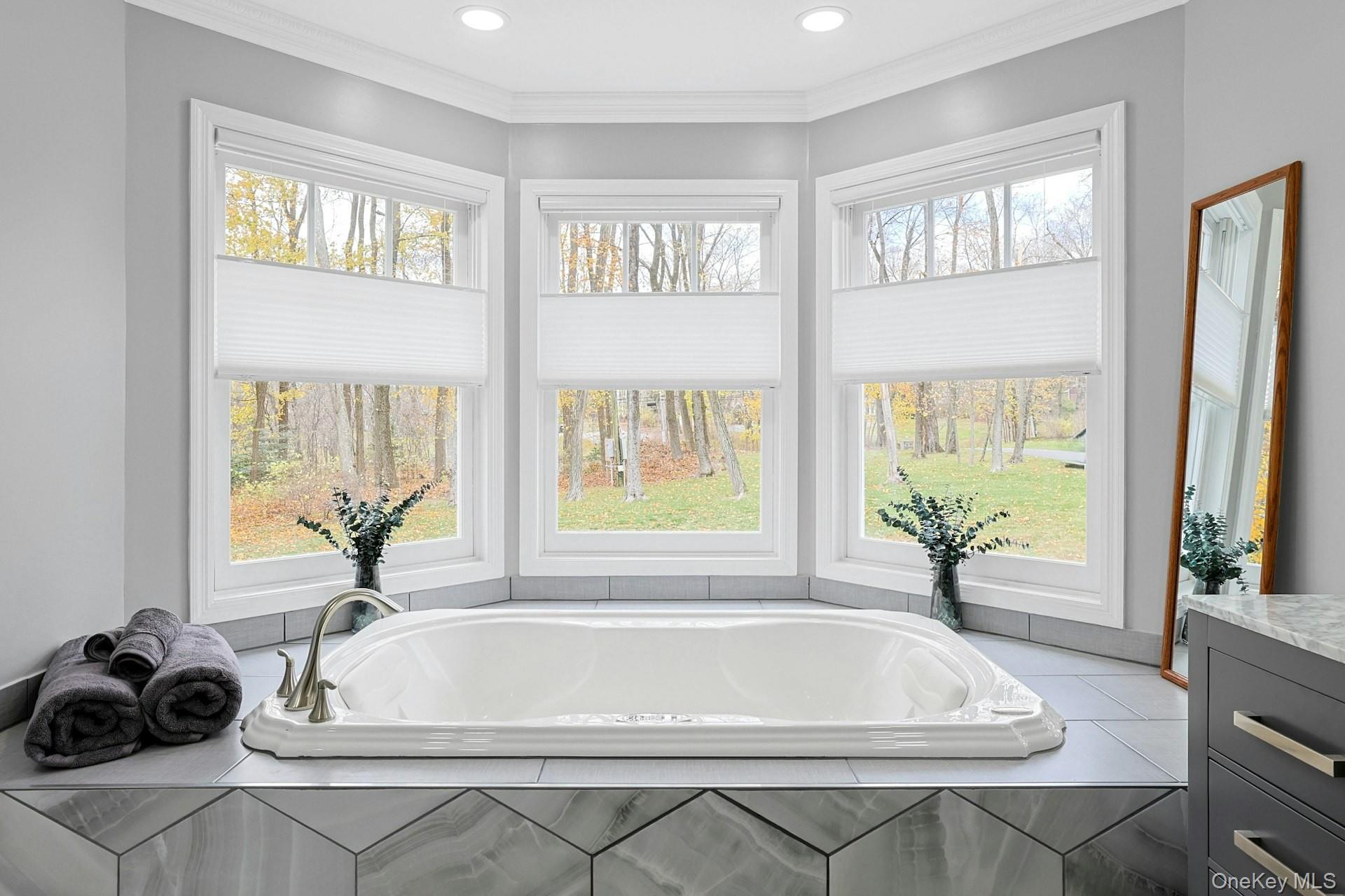 8 Creemer Road Armonk, NY 10504 - Photo 18 of 38 a bath tub sitting in a room next to a window