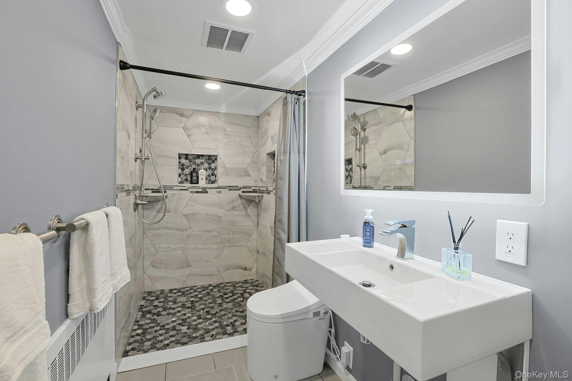8 Creemer Road Armonk, NY 10504 - Photo 26 of 38 a bathroom with a sink toilet and shower