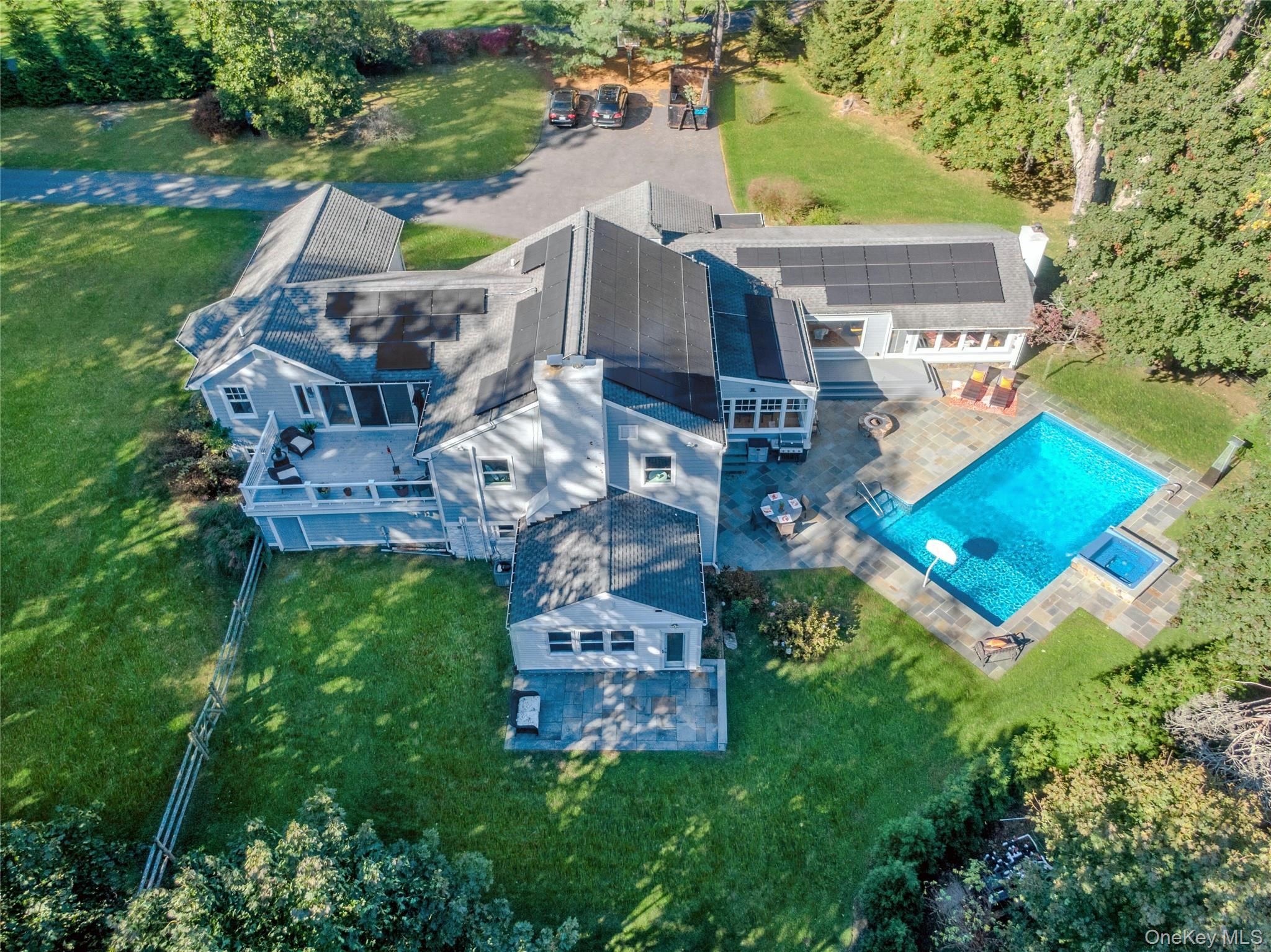8 Creemer Road Armonk, NY 10504 - Photo 34 of 38 an aerial view of a house with a garden
