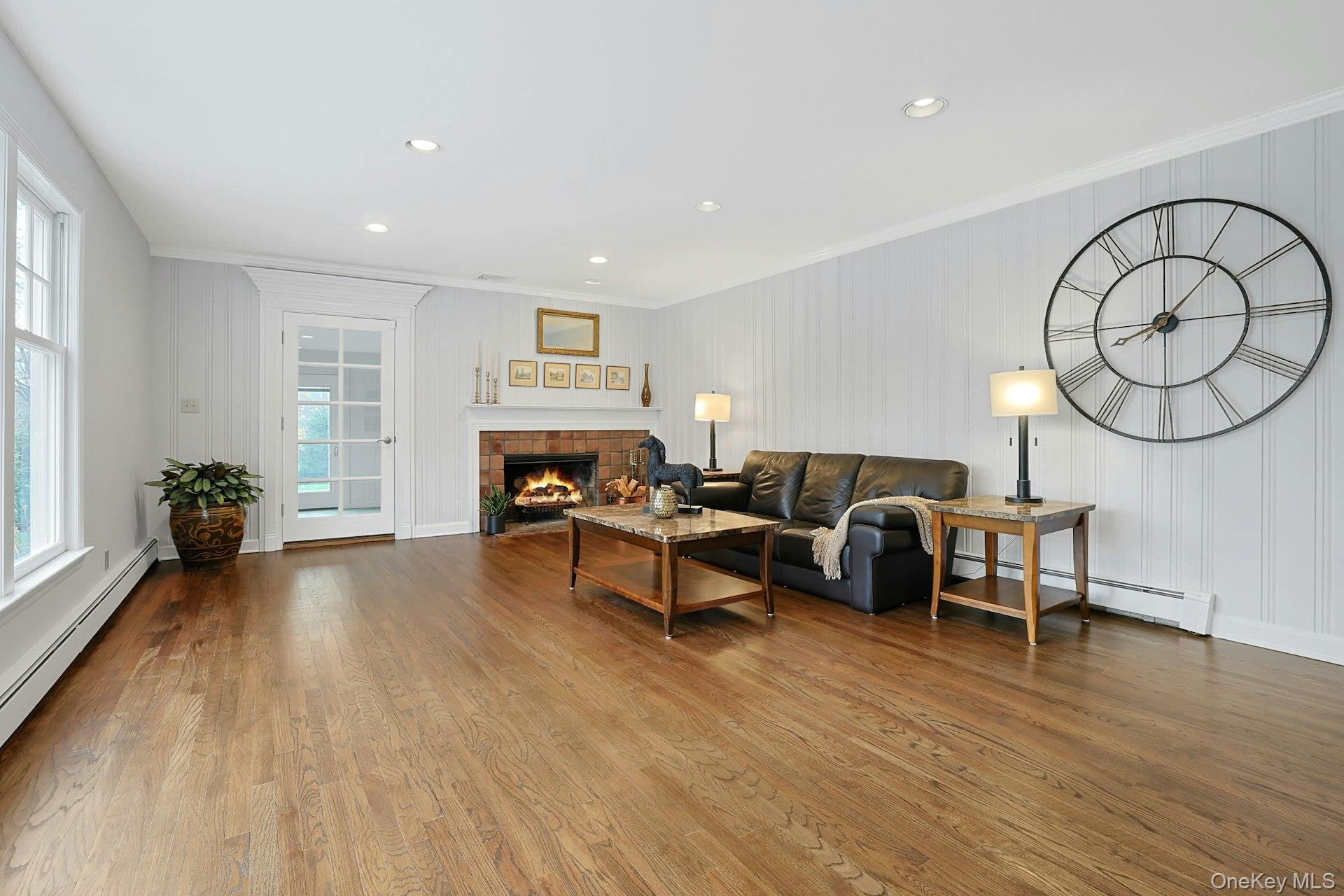 8 Creemer Road Armonk, NY 10504 - Photo 8 of 38 a living room with furniture and a fireplace