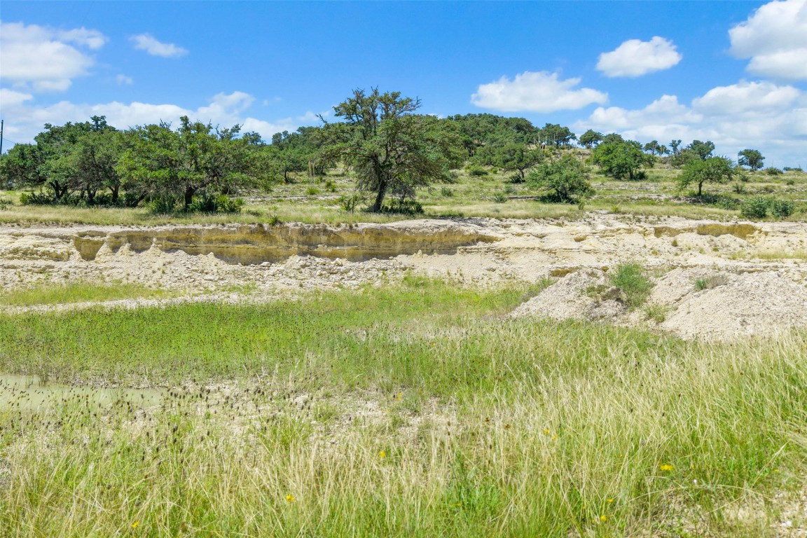 5434 Kendalia Road Blanco, TX 78606 - Photo 12 of 40 a view of a lake with a big yard