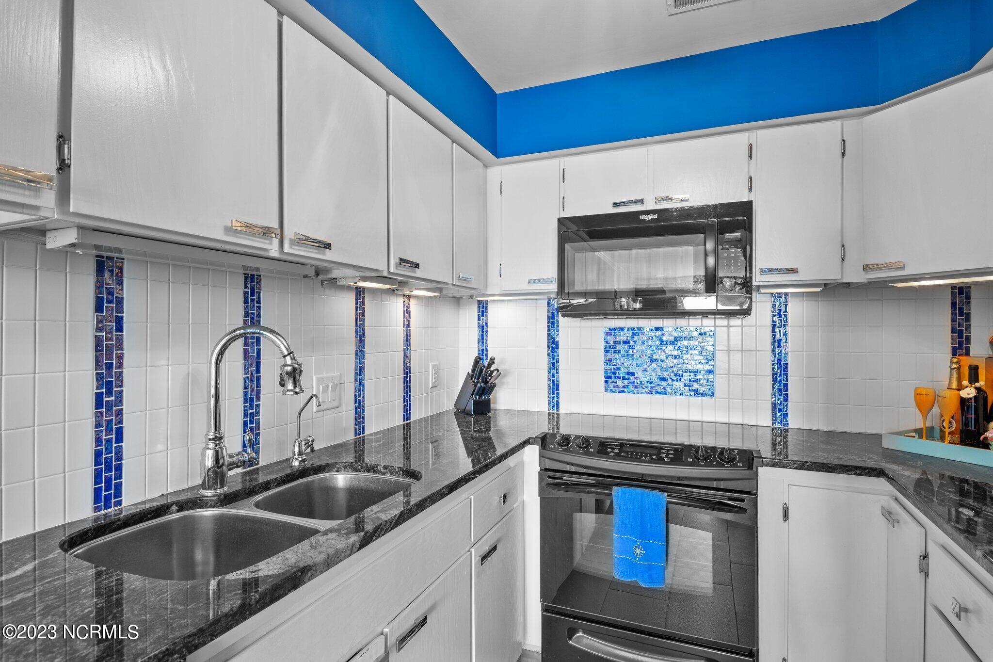 545 Salter Path Road, Unit L5 Pine Knoll Shores, NC 28512 - Photo 13 of 54 Granite countertops with custom tile backsplash
