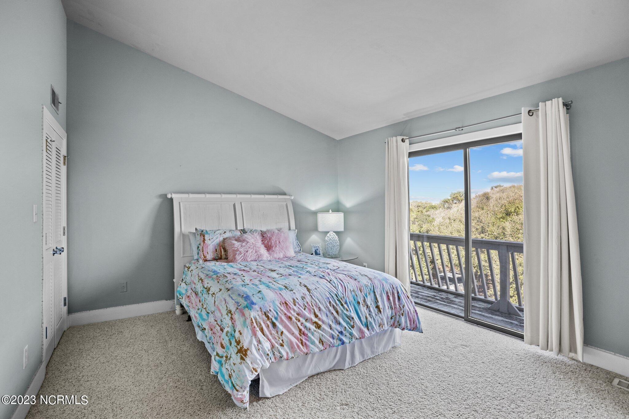 545 Salter Path Road, Unit L5 Pine Knoll Shores, NC 28512 - Photo 23 of 54 Vaulted ceilings in upstairs Guest Bedroom