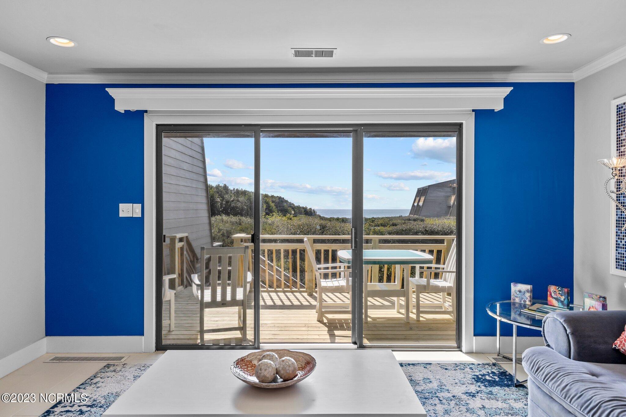 545 Salter Path Road, Unit L5 Pine Knoll Shores, NC 28512 - Photo 9 of 54 Triple panel sliding glass door