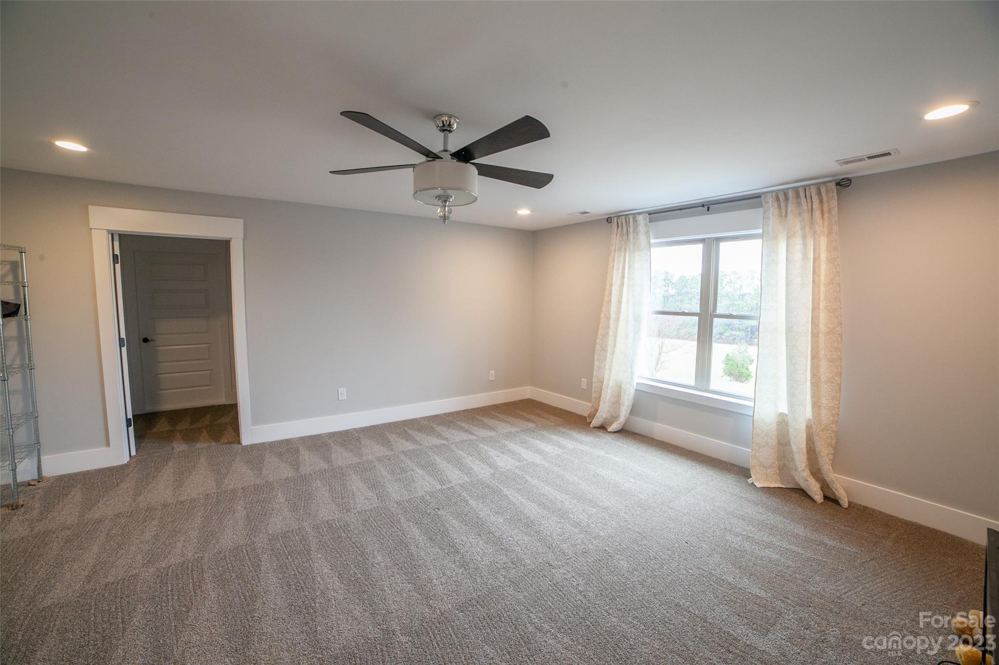 169 Thomas Road Clover, SC 29710 - Photo 36 of 47 an empty room with wooden floor and windows