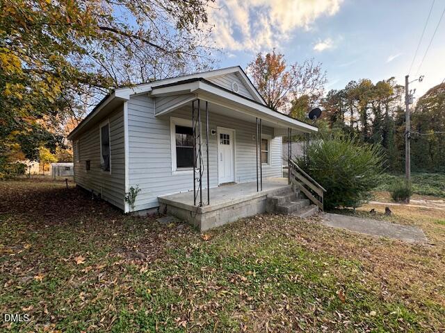 521 Spring Court Henderson, NC 27536 - Photo 2 of 4 a view of a house with a yard