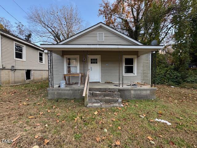 521 Spring Court Henderson, NC 27536 - Photo 4 of 4 a front view of a house with garden