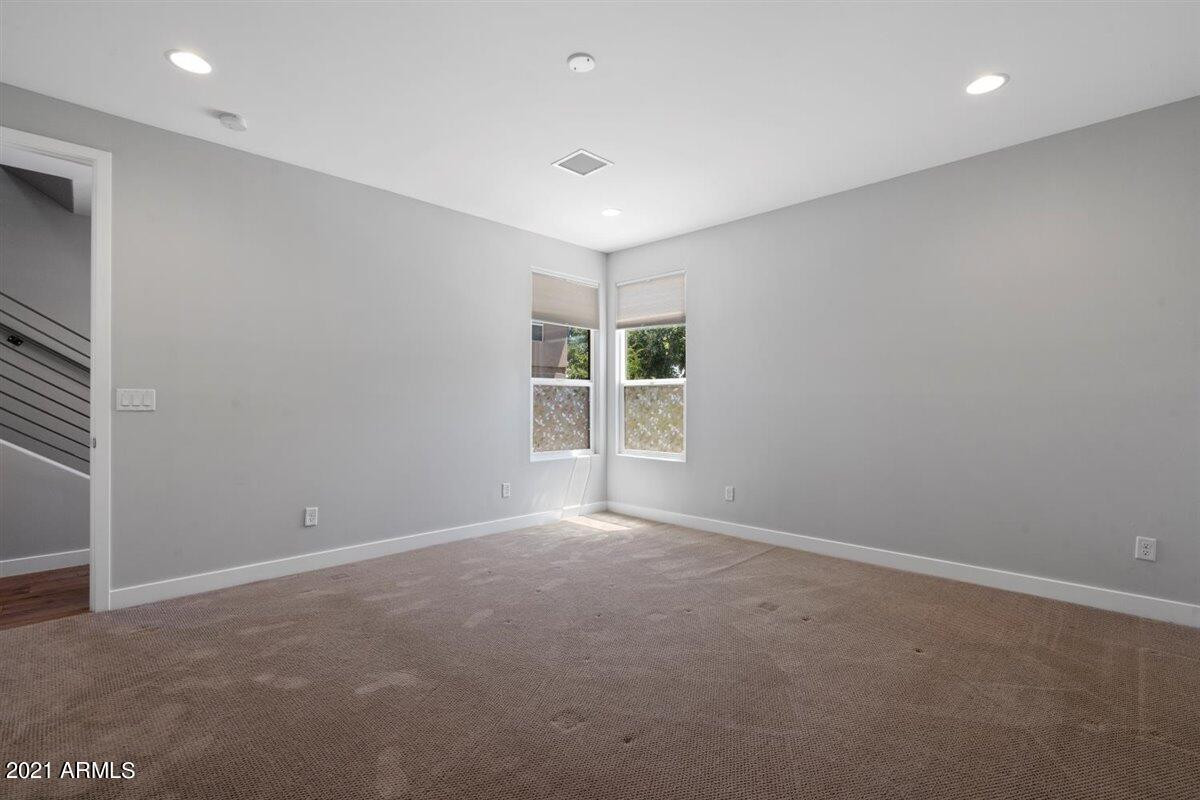 1214 West 5th Street, Unit 2 Tempe, AZ 85281 - Photo 20 of 26 an empty room with windows