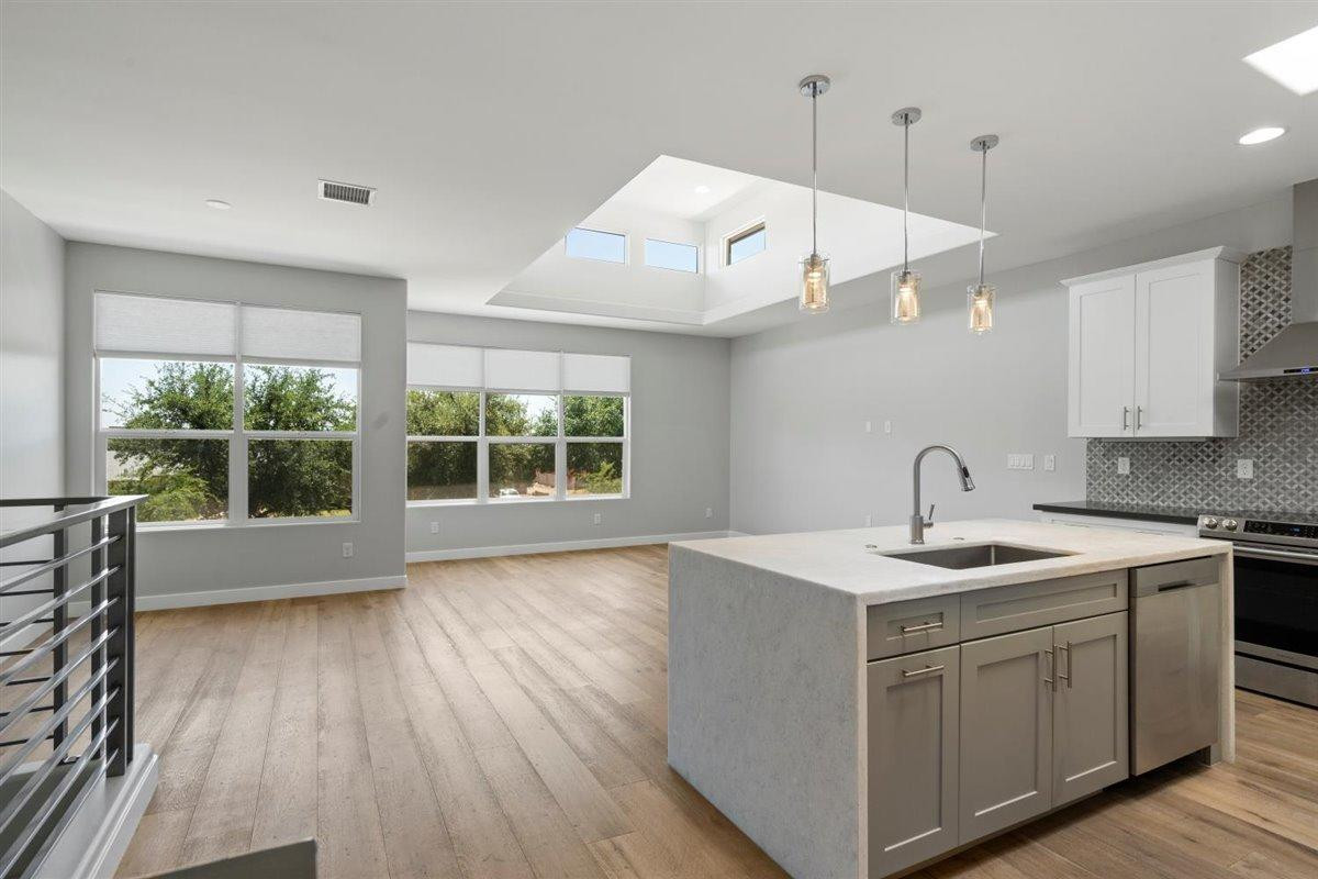 1214 West 5th Street, Unit 2 Tempe, AZ 85281 - Photo 2 of 26 a kitchen with a sink a window and cabinets