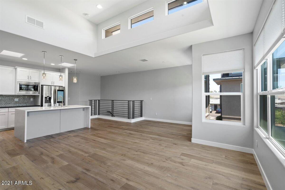 1214 West 5th Street, Unit 2 Tempe, AZ 85281 - Photo 7 of 26 a view of kitchen with refrigerator and white cabinets