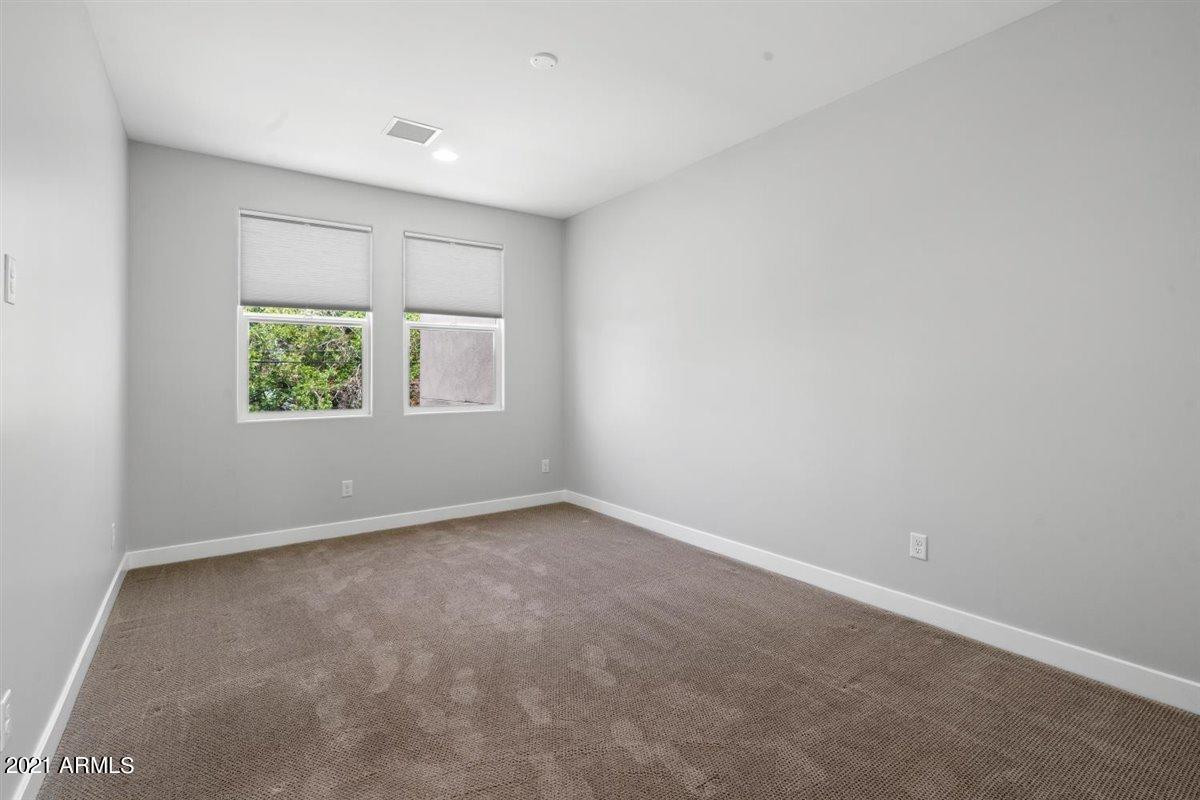 1214 West 5th Street, Unit 2 Tempe, AZ 85281 - Photo 9 of 26 an empty room with windows