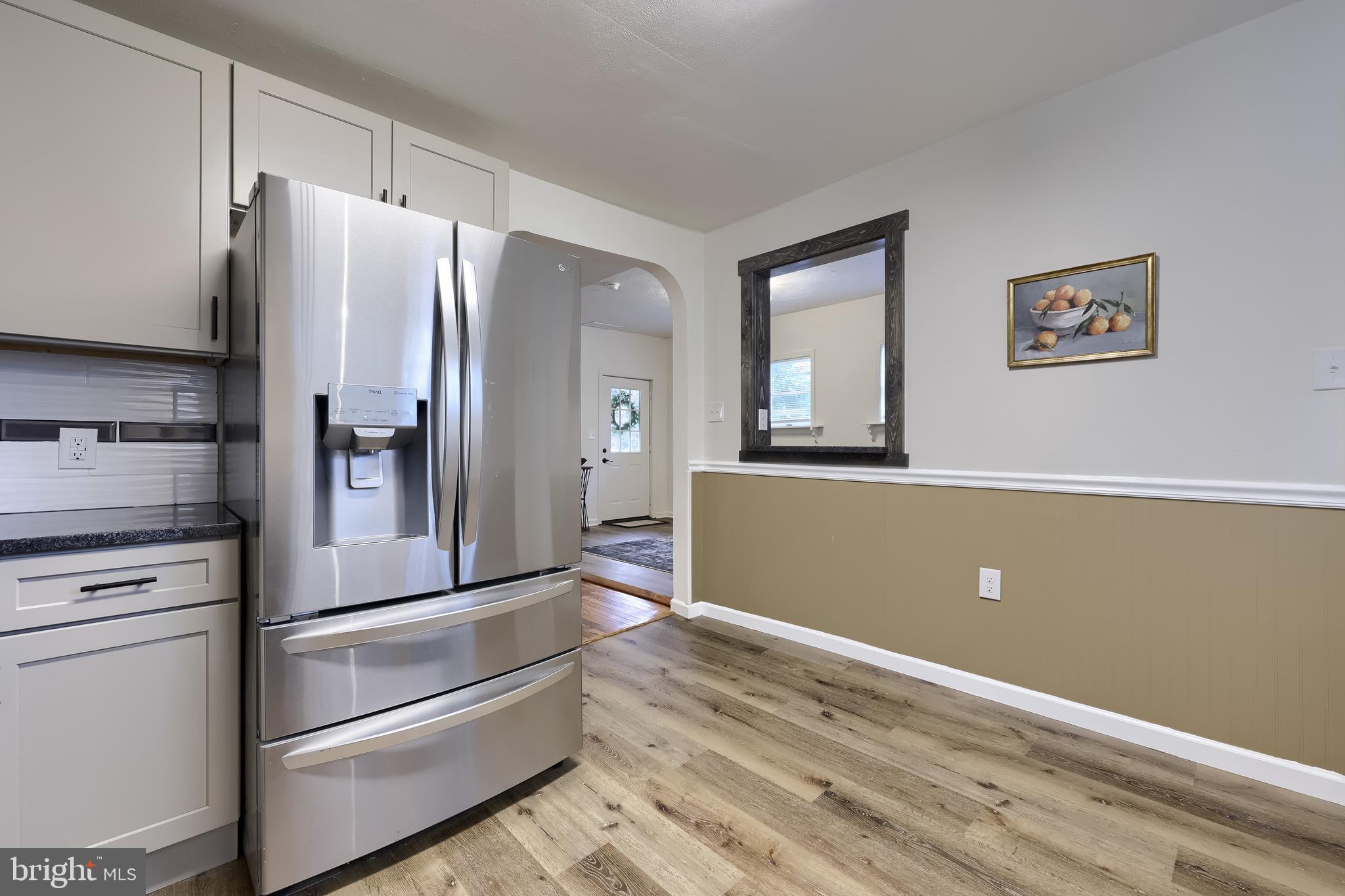 643 Franklin Street Columbia, PA 17512 - Photo 13 of 46 a kitchen with stainless steel appliances cabinets and wooden floor