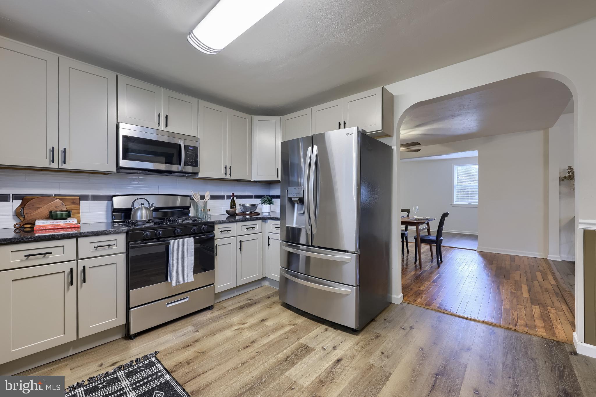 643 Franklin Street Columbia, PA 17512 - Photo 14 of 46 a kitchen with wooden floors and stainless steel appliances