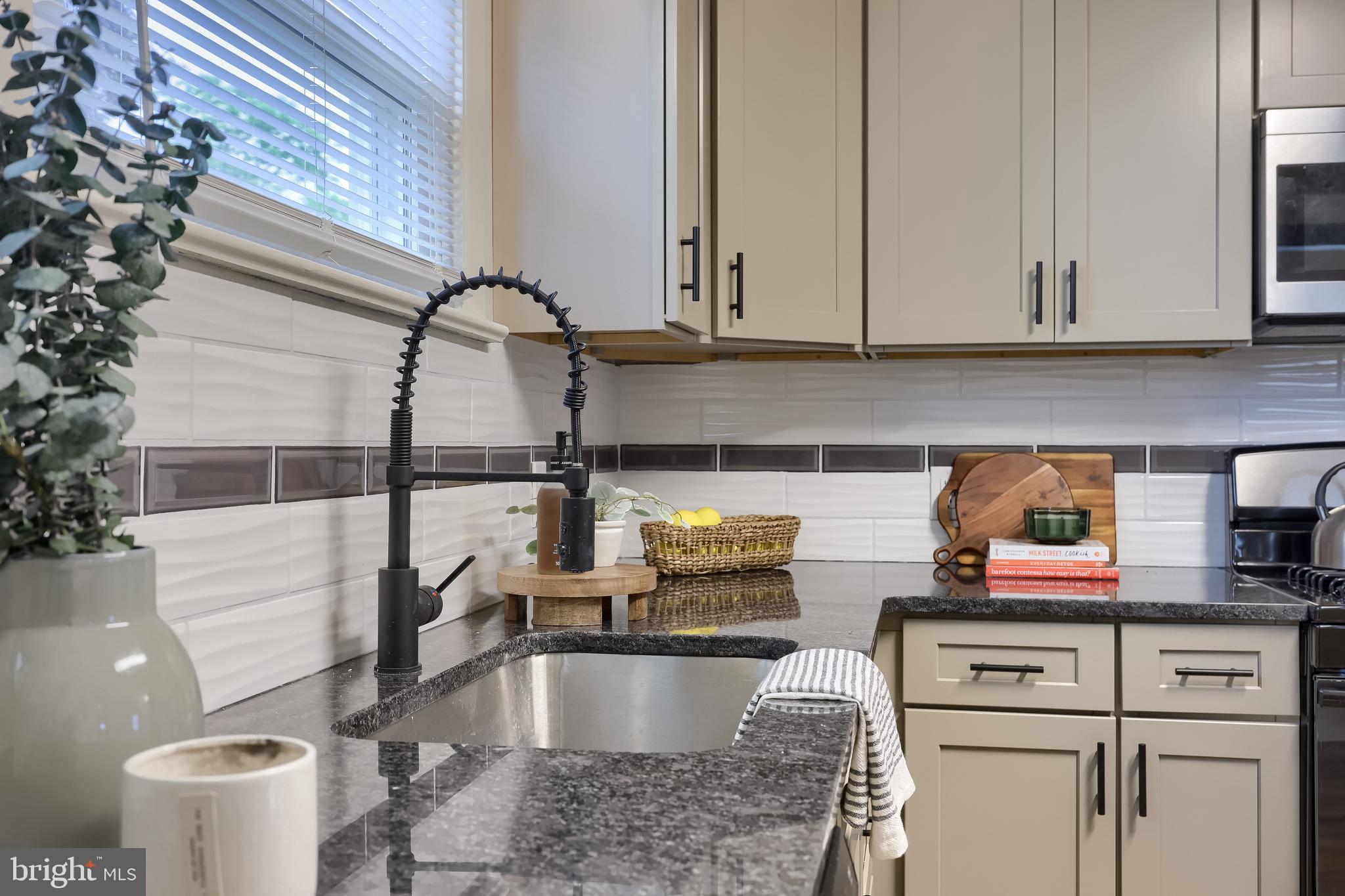 643 Franklin Street Columbia, PA 17512 - Photo 15 of 46 a kitchen with stainless steel appliances granite countertop a sink and cabinets