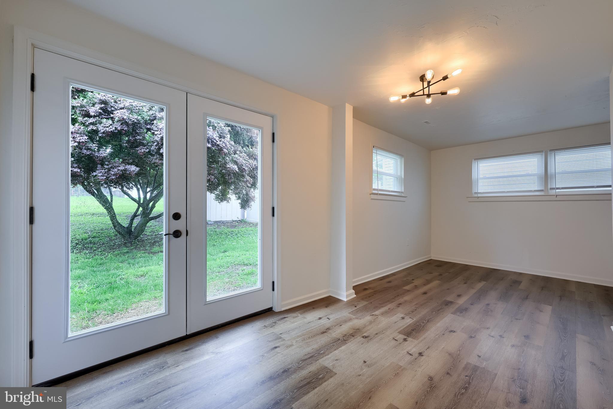 643 Franklin Street Columbia, PA 17512 - Photo 30 of 46 a view of an empty room with wooden floor and a window