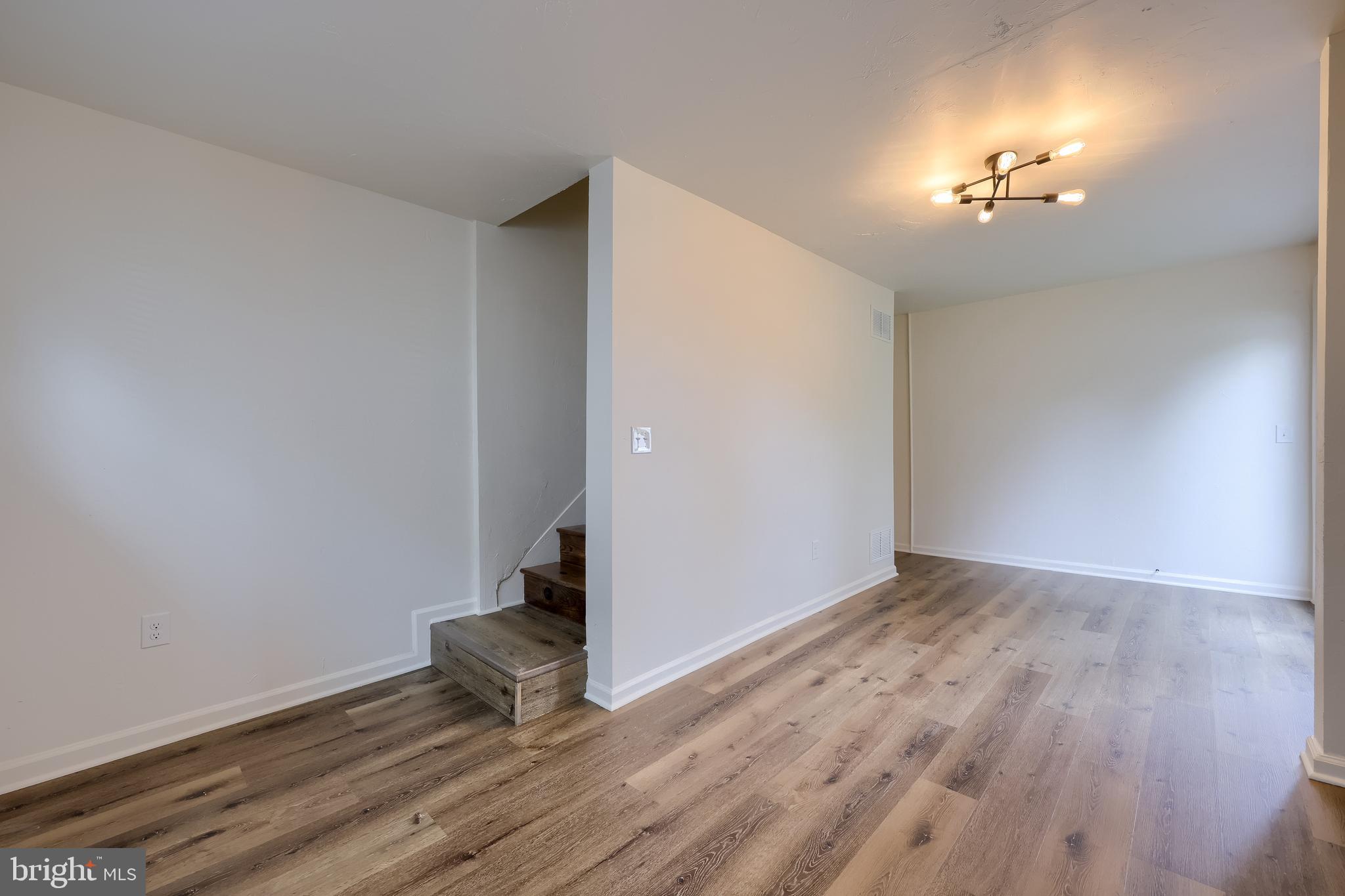 643 Franklin Street Columbia, PA 17512 - Photo 31 of 46 wooden floor in an empty room with a window