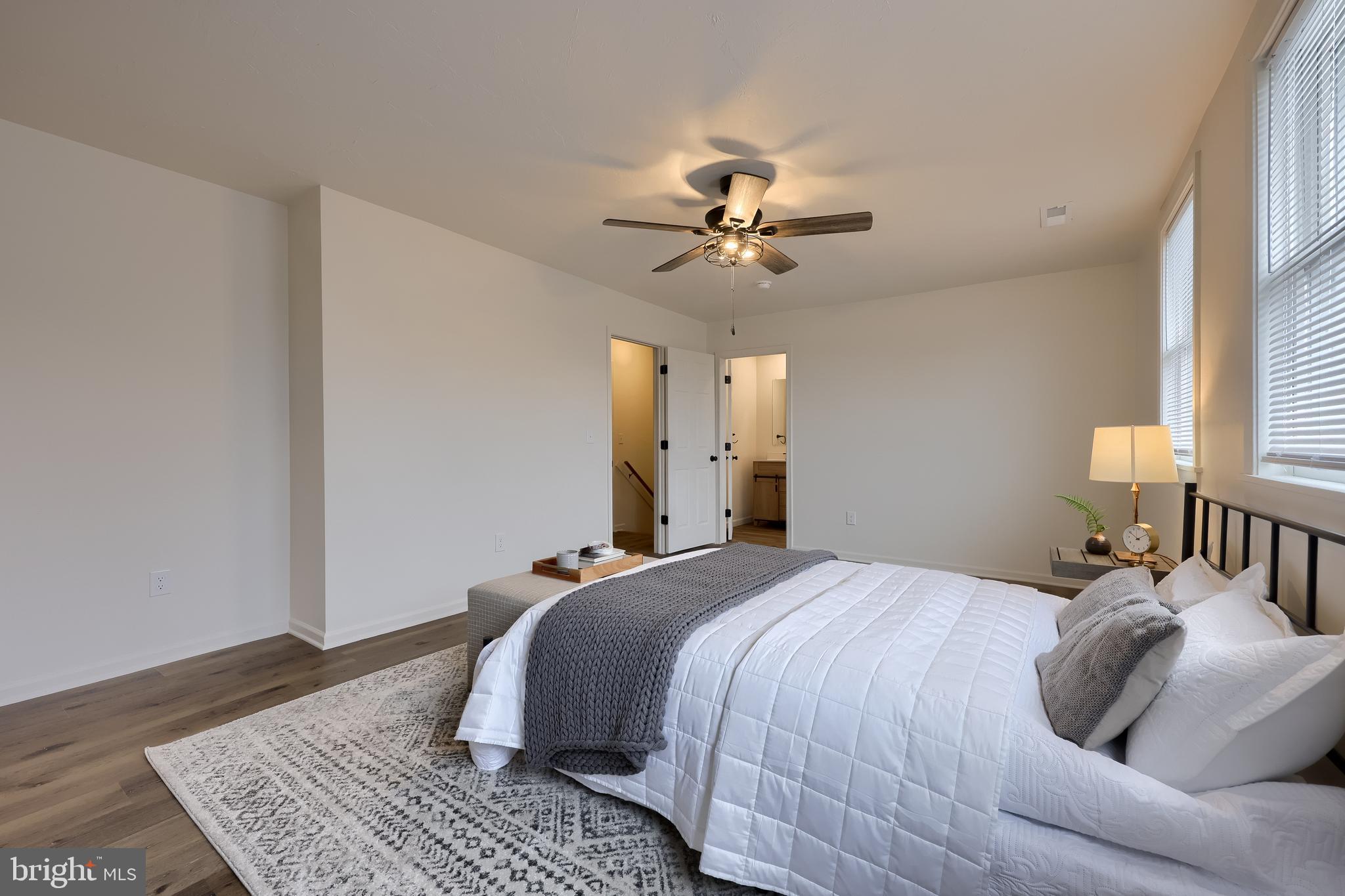 643 Franklin Street Columbia, PA 17512 - Photo 36 of 46 a bedroom with a large bed and a chandelier