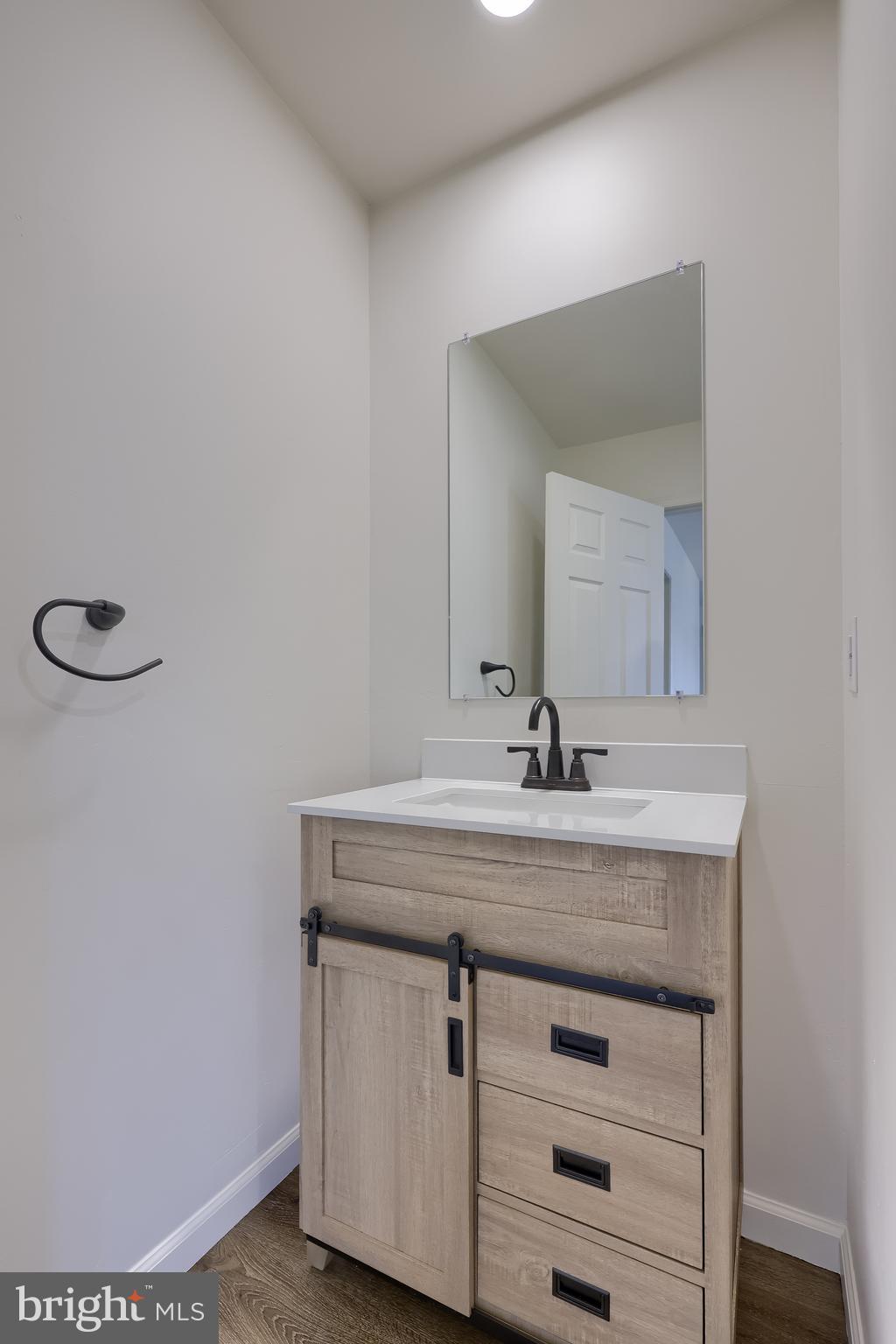 643 Franklin Street Columbia, PA 17512 - Photo 40 of 46 a bathroom with a granite countertop sink and a mirror