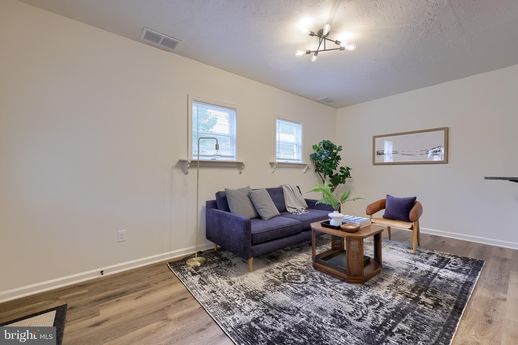 643 Franklin Street Columbia, PA 17512 - Photo 4 of 46 a living room with furniture and a potted plant