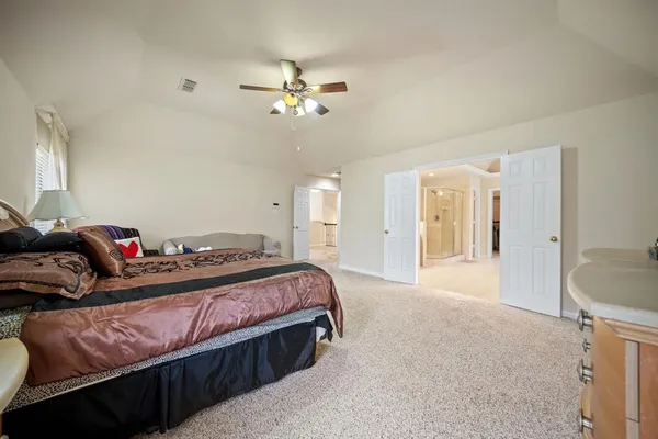 a bathroom with a double vanity sink mirror and shower