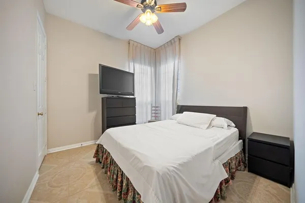 a bathroom with a granite countertop sink a toilet and a mirror