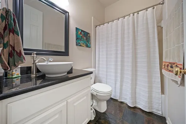 a view of a livingroom with a ceiling fan and a window
