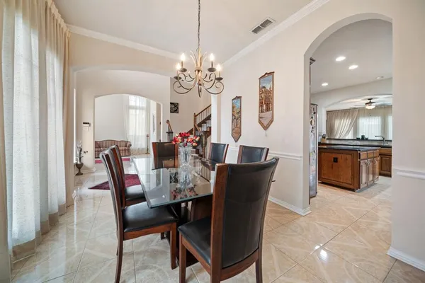 a kitchen with stainless steel appliances granite countertop a stove a sink dishwasher and a microwave oven with cabinets