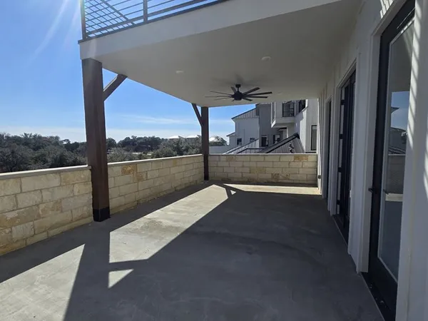 a view of a balcony with furniture