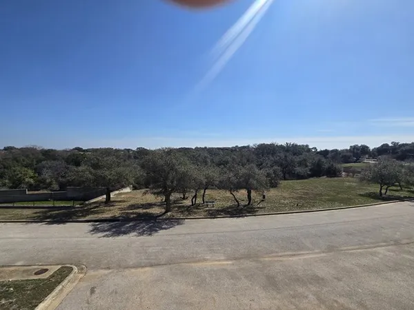 a view of a road with a yard