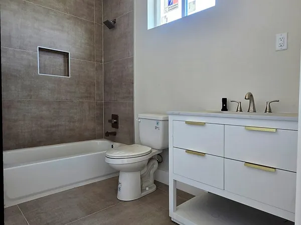 a bathroom with a toilet sink and bathtub