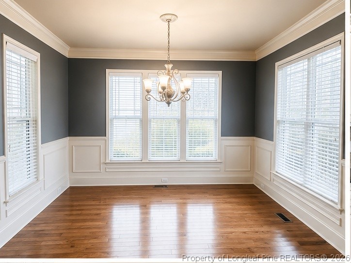 175 Pine Hawk Drive Spring Lake, NC 28390 - Photo 7 of 43 a view of an empty room with wooden floor and a window