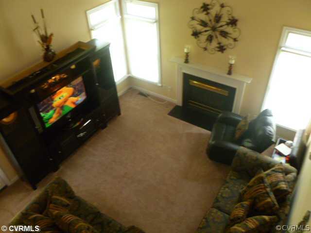 5403 Meadow Chase Road Midlothian, VA 23112 - Photo 12 of 22 a living room with furniture and a flat screen tv