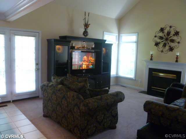 5403 Meadow Chase Road Midlothian, VA 23112 - Photo 10 of 22 a living room with furniture and a flat screen tv