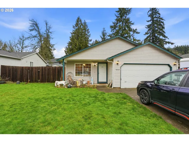 a backyard of a house with table and chairs