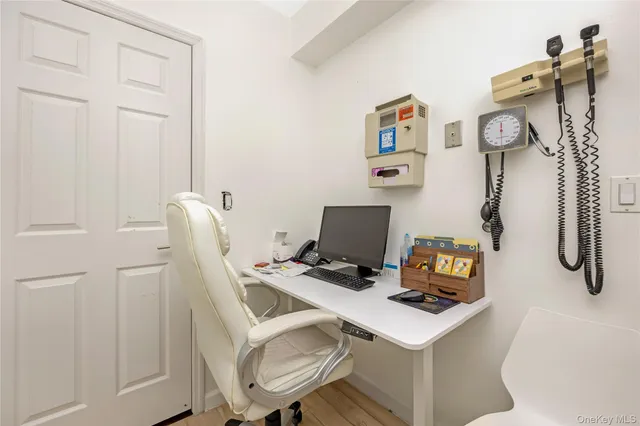 a view of a workspace with furniture