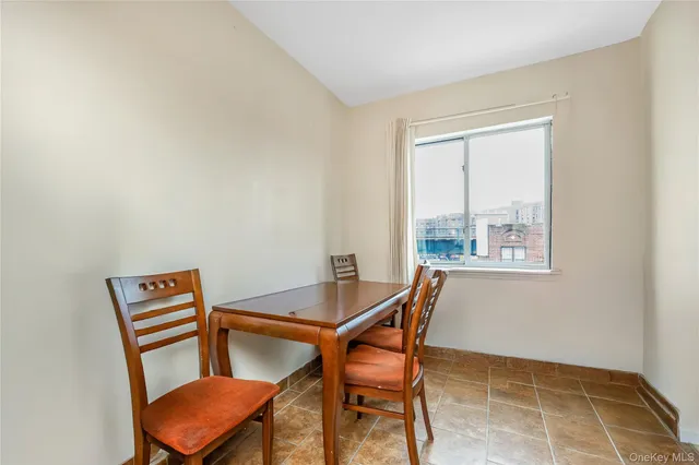 a view of a room with furniture and wooden floor