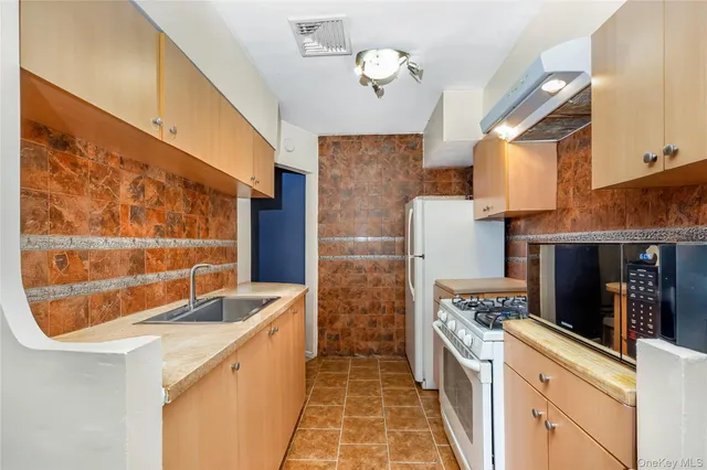 a kitchen with a stove and a refrigerator