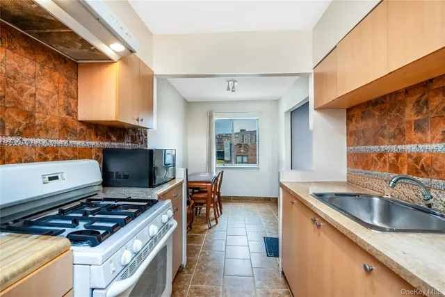 a kitchen that has a sink and a stove