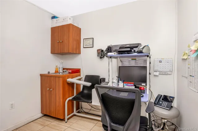 a view of workspace with wooden floor windows