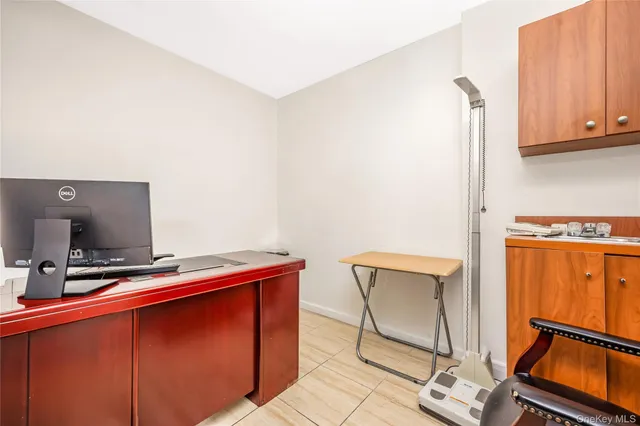 a room with furniture and air conditioner vent