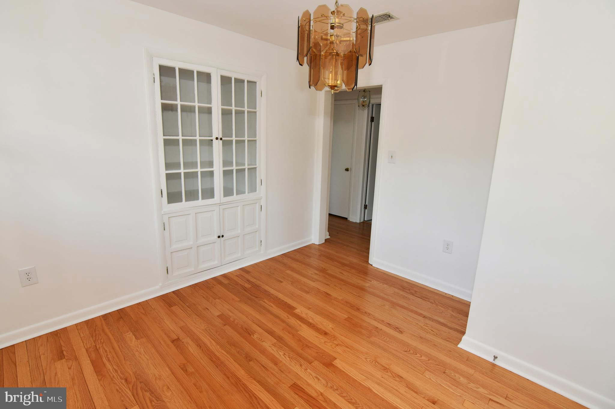 437 Beechcroft Road Winchester, VA 22601 - Photo 22 of 52 a view of empty room with wooden floor and fan