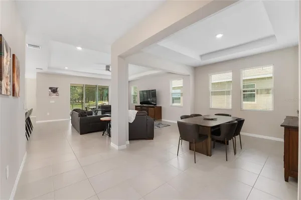 a large kitchen with stainless steel appliances kitchen island granite countertop a large counter top and view of kitchen
